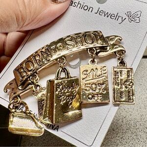 Gold Tone 'Born to Shop' Charm Brooch